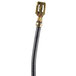 A close up of a black Waring fuse assembly with a gold cable and plug.