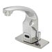 A T&S chrome hands-free sensor faucet with a deck plate.