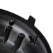 A close-up of a black plastic base with holes in it.