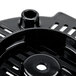 A close-up of black plastic bottom housing for a Waring blender with holes.