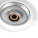 A metal circular object with a hole in it.