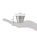 A hand holding a small metal cup with ribbed sides.