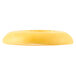A yellow Waring bearing cap with a hole in the middle.