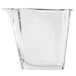 A clear plastic measuring cup with a long handle.