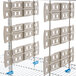 A white Metro shelf divider on a wire rack with many holes.