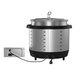 A Vollrath silver drop-in induction warmer with a large pot and lid inside.