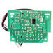 A green circuit board with black wires and a connector.
