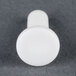 A white plastic actuating lever for a food processor.