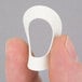 A person holding a small white rubber washer.