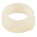 A white circular object with a hole.