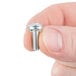 A person holding a Waring screw for a blender.