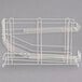 A white wire Metro can rack with two baskets.