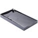 A black rectangular plastic tray with a white circle on the bottom.