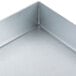 A close-up of a metal corner of a Waring insulation cover for griddles.