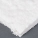 White cotton insulation for a Waring griddle on a gray surface.