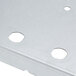A metal Waring insulation plate with holes.