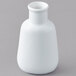 An American Metalcraft white porcelain round vase holding a small amount of liquid.