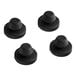 A group of black round rubber caps with a round top and hole in the center.