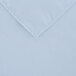 A light blue square cloth table cover with a white hem.