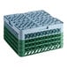 A Noble Warewashing 36-compartment gray full-size glass rack with four green extenders.