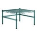 A green metal Regency wire shelf with legs.