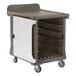 A white and brown Cambro meal delivery cart with a door.