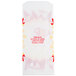 A white paper bag with red and yellow designs.