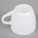 A white espresso cup with a handle.