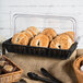 A polycarbonate cover on a basket of food.