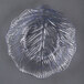 A clear plastic plate with a leaf design.