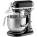 A black and silver KitchenAid bowl lift countertop mixer with a bowl.