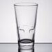 A close-up of a Libbey stackable beverage glass on a table.