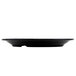 A black rectangular melamine plate with a textured rim.