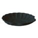 A black shell-shaped plate with a scalloped edge.