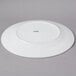 A white CAC Harmony porcelain plate.