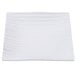 A white square plate with wavy lines.