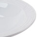 A CAC white porcelain bowl with an embossed rim.
