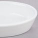 a white bowl on a gray surface