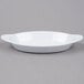 A white oval dish with two handles.