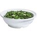 A white GET Geneva melamine bowl filled with kale salad.