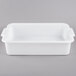 A white rectangular Vollrath perforated drain box with handles.