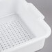 A white plastic Vollrath perforated drain box.