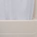 A white Oxford shower curtain with a sheer voile window panel hanging in a bathtub.