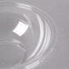 A Fineline clear plastic bowl with a lid.