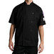 a man wearing a black chef coat
