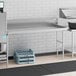 A Regency stainless steel dish table with a sink and a right drainboard.