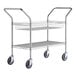 A Regency chrome utility cart with 1 shelf and 1 basket on wheels.