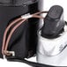 A close-up of a black and silver 1/15 hp Fan Motor cylinder with wires.