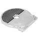 A stainless steel circular dicing grid with a hole in the center.