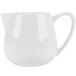 A white porcelain creamer with a handle.